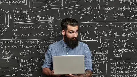 Brutal bearded man on a chalkboard background