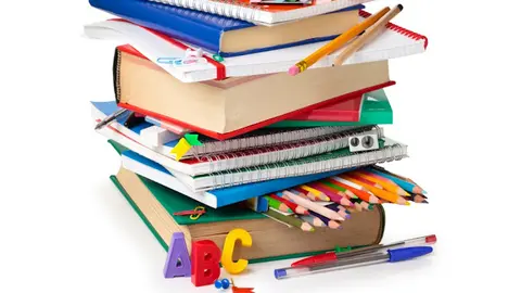 School supplies and green apple isolated on white background.